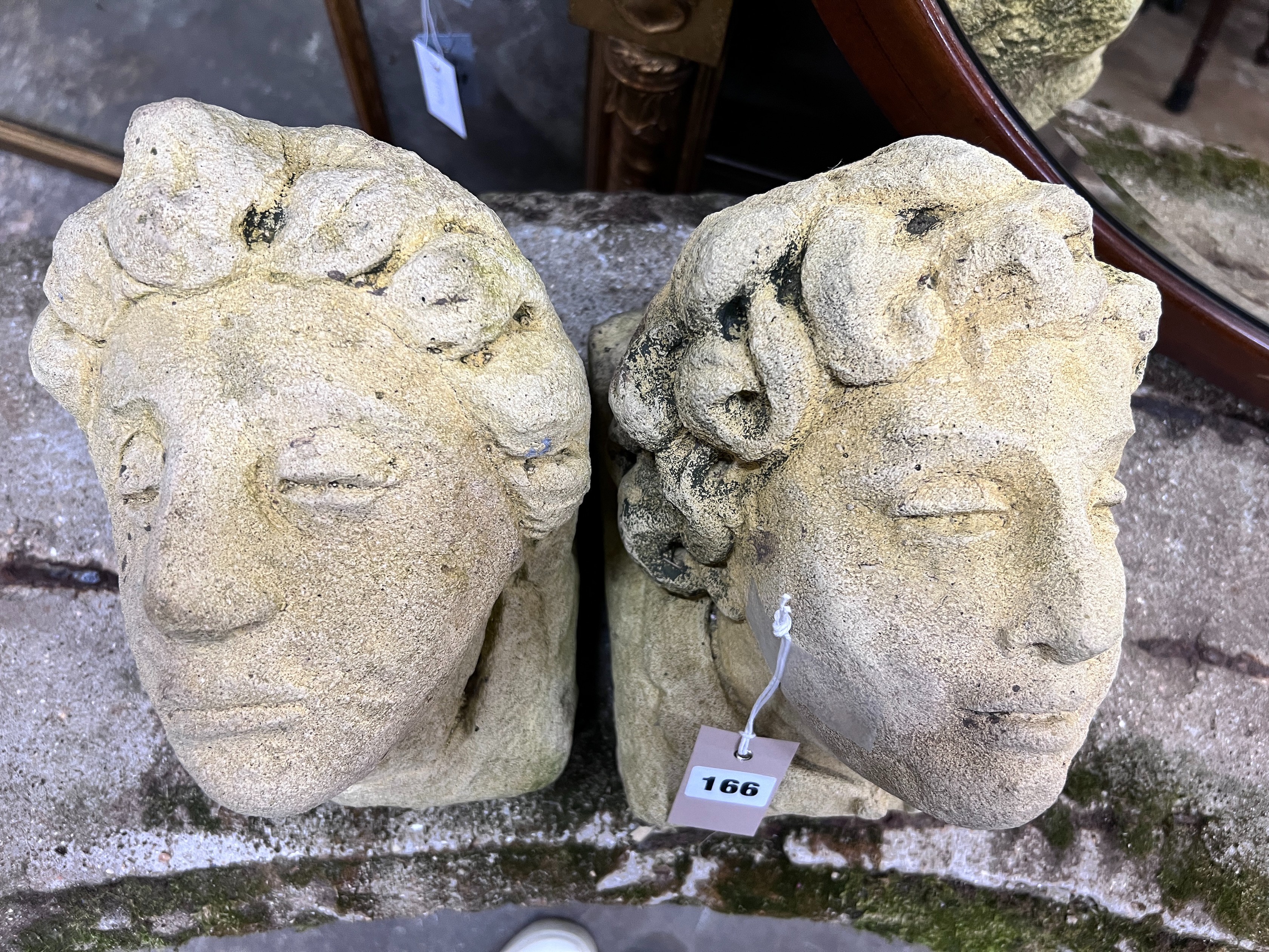 A pair of reconstituted stone corbels, height 22cm *Please note the sale commences at 9am.